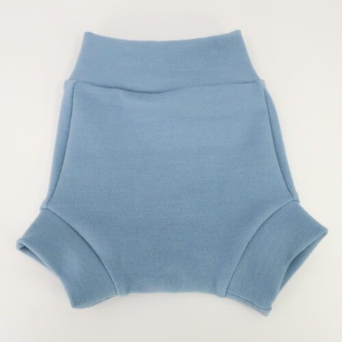 Our Brief Fit Wool Diaper Cover. This cover is a bit taller and more trim fitting that our Traditional style of cover. The leg cuffs are also small/tighter and longer. This cover is light blue.