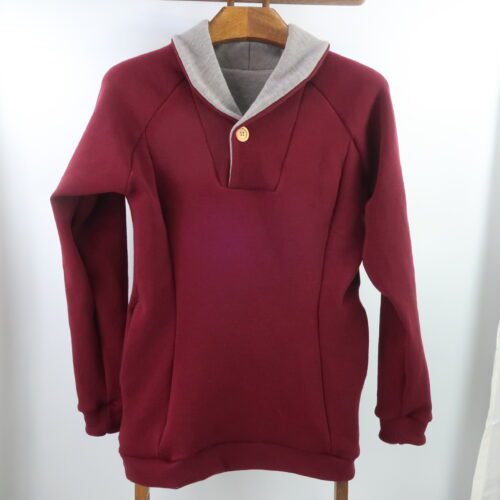 Unisex Adult Campfire Sweater. Merino Wool. Sweater with a fold over collar, possibly two toned, with a button closure. Wine red colour with a light brownie/grey melange on the inside of the collar.