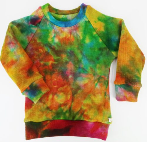 Merino Wool Simple Crew Neck Sweater. With cuffed raglan sleeves and a classic rounded crew neck. This sweater is a tie dyed striped rainbow colour.
